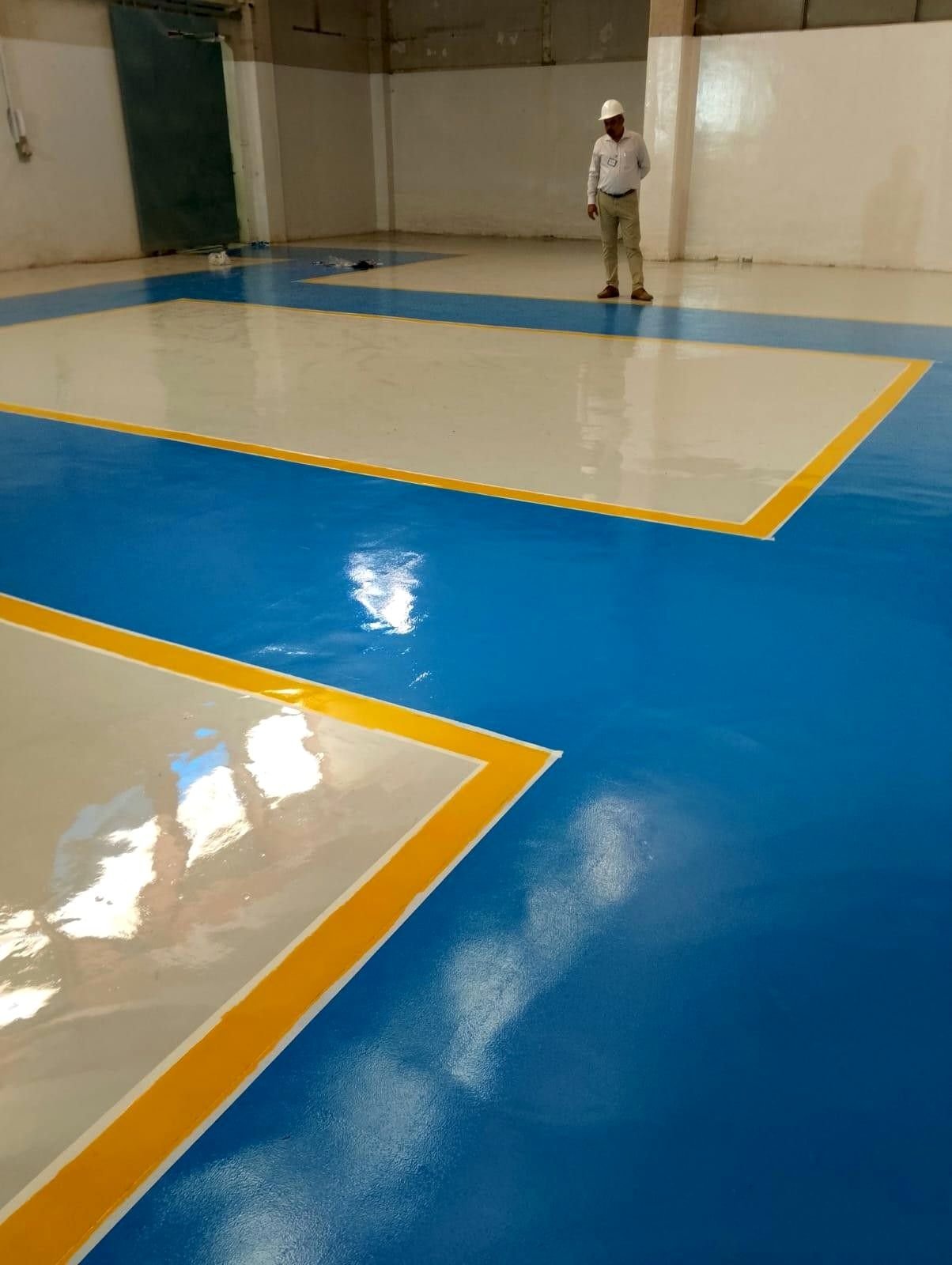 Zone-marked epoxy flooring in an industrial facility